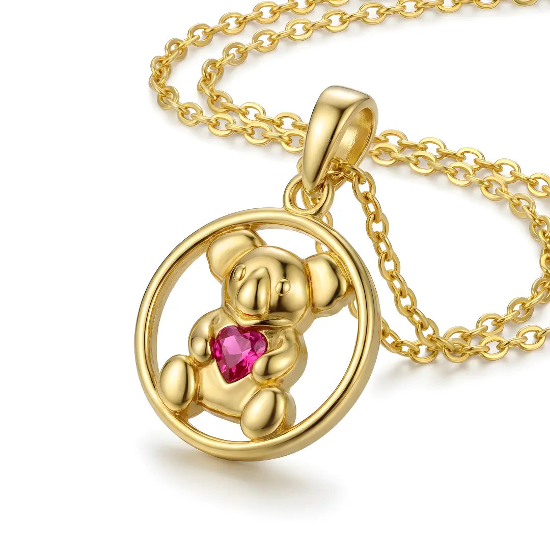 18k Gold Koala pendant with a ruby cz heart on a gold chain against a white background