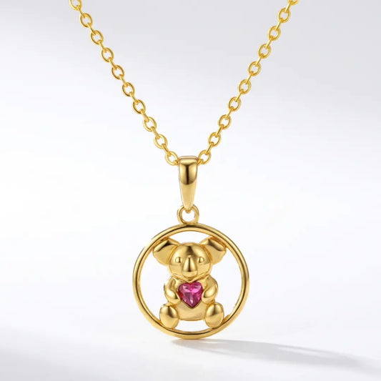 18 Gold vermeil Koala pendant with a ruby cz heart on a white background