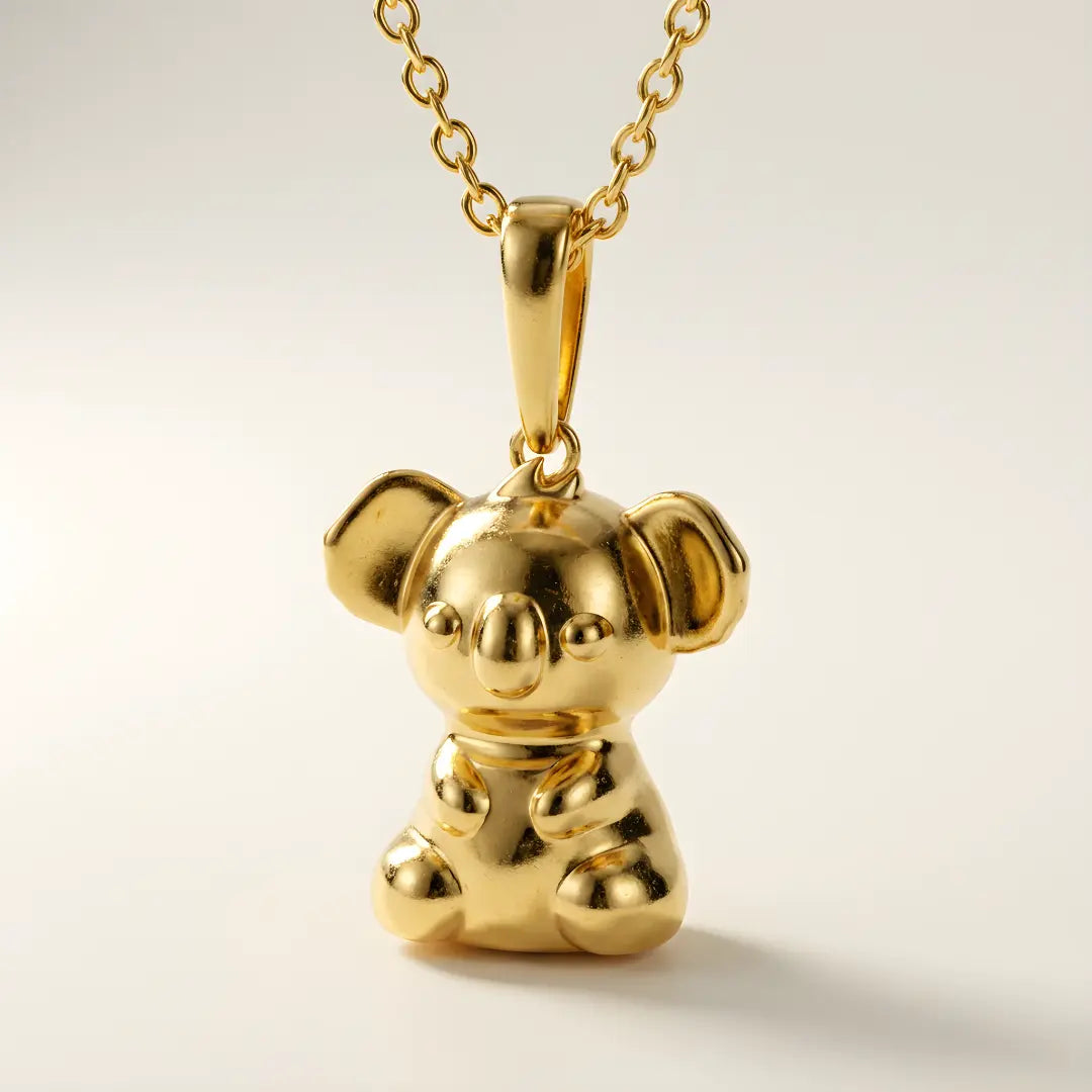 18 Gold Vermeil 3d Koala pendant on a chain against a light background