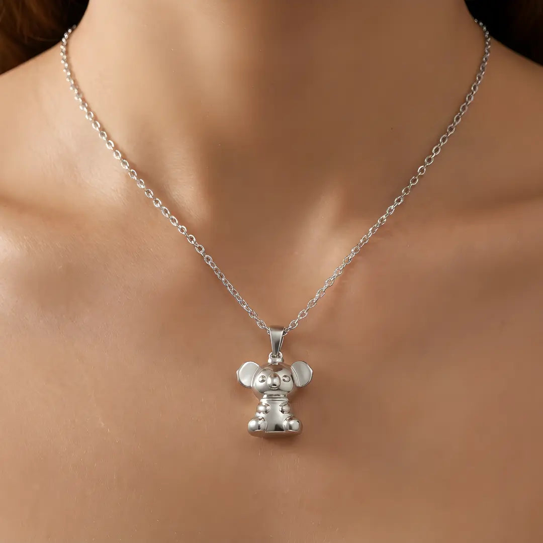 Silver necklace with a 3d Koala pendant on a person