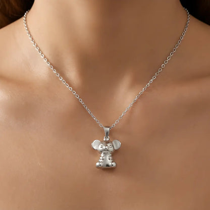 Silver necklace with a 3d Koala pendant on a person