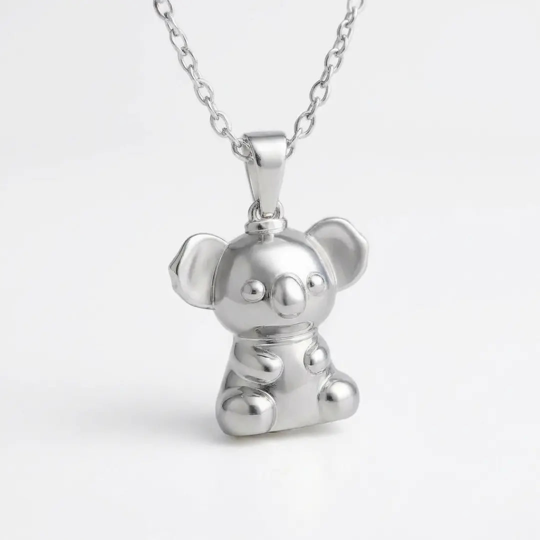 Silver 3d koala pendant necklace on a light grey background