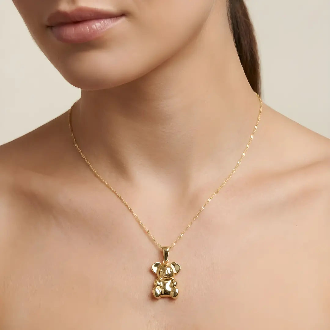 9ct Gold Koala pendant necklace on a model against a neutral background