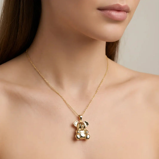 9ct Gold Koala pendant necklace on a model against a neutral background