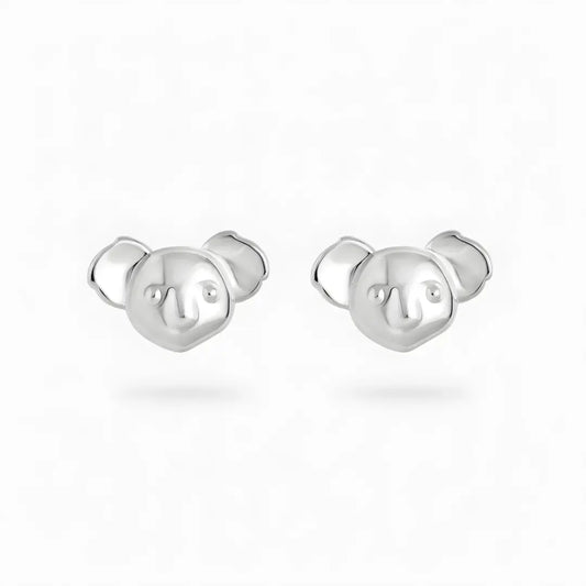 Silver Koala-shaped stud earrings on a white background