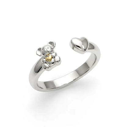 Silver ring with a small Koala and 10k Gold heart design on a white background